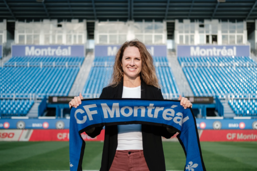 Amy Walsh holding a Montreal scarf