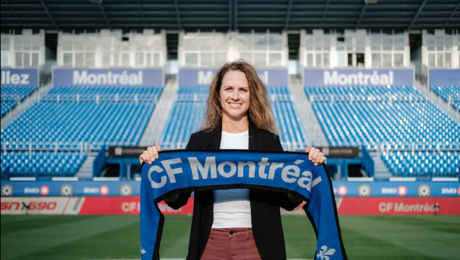 Amy Walsh holding a Montreal scarf